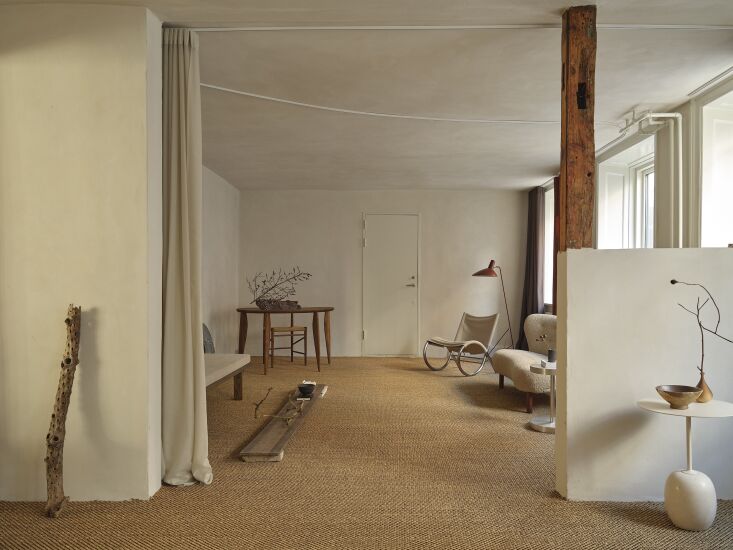 a desk area is designed with a ferm living feve desk, the frama richardt chair, 18