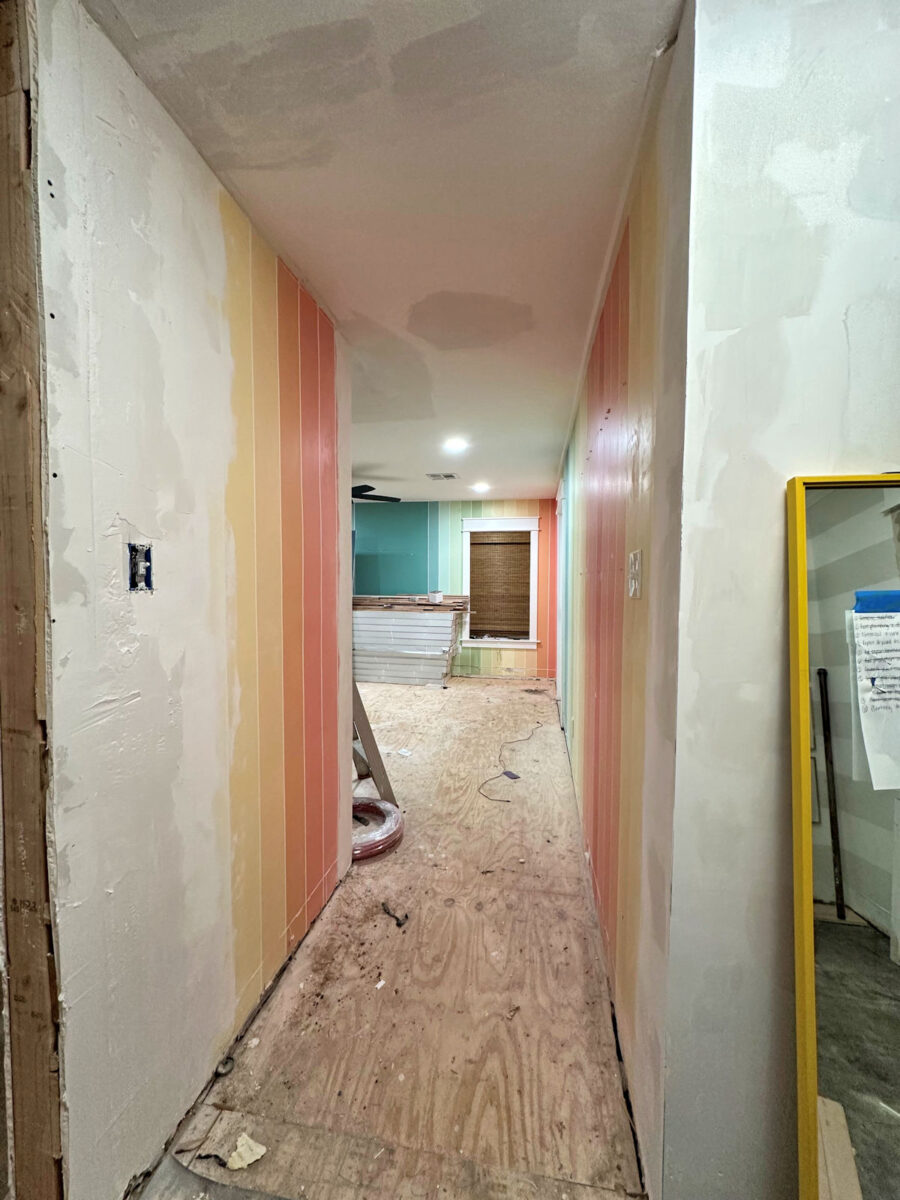 an aerial view of waves crashing against a shore.