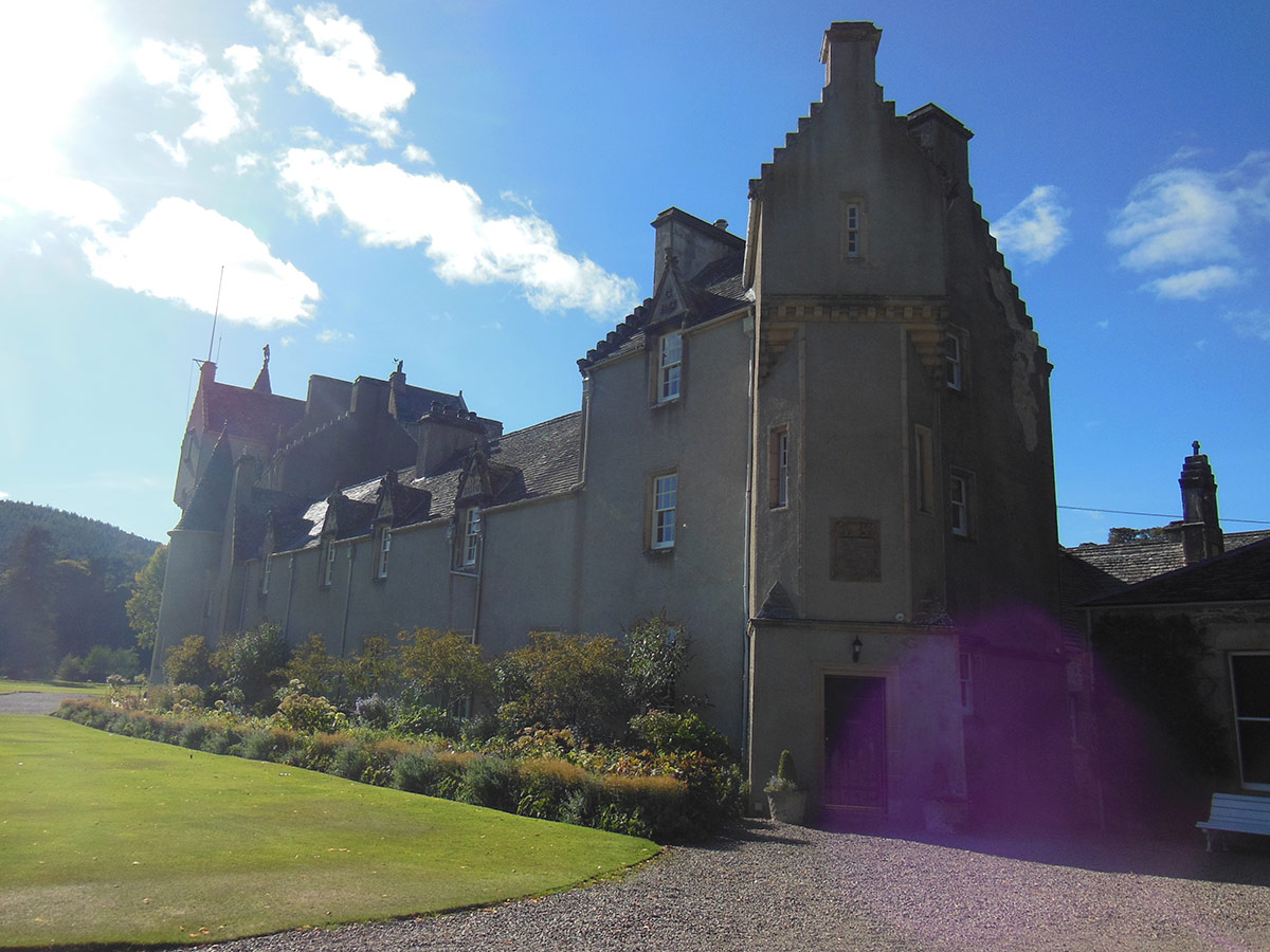 scottish castle with flower beds in front