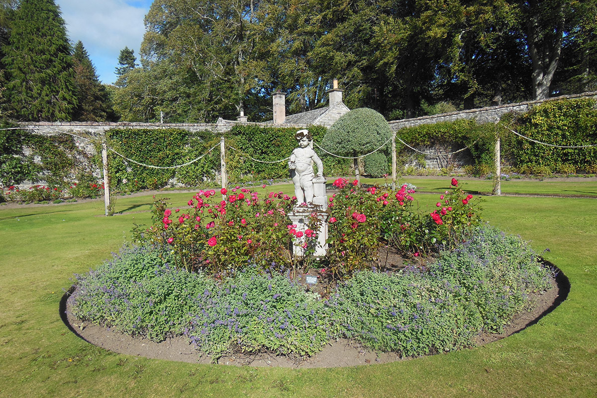 circular garden with with statue in the middle
