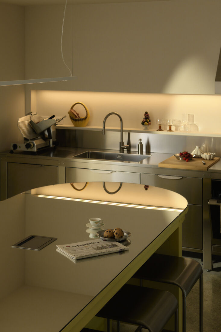 the communal kitchen is designed by very simple kitchen—stainless steel on on 20