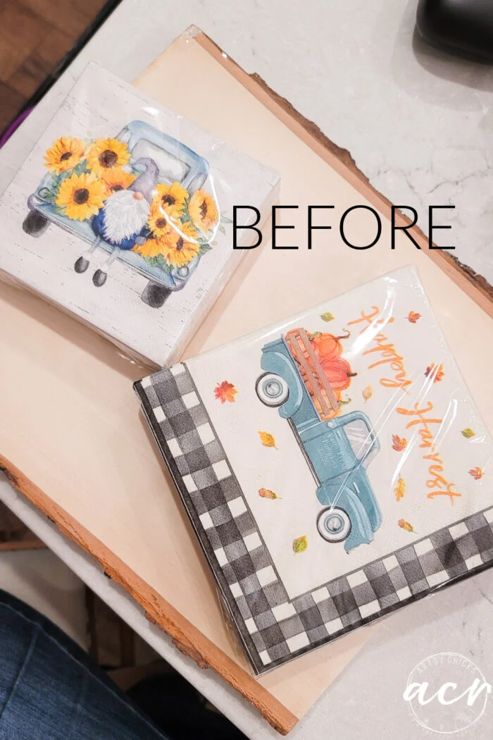 two square napkins with vintage blue trucks—one featuring sunflowers and a gnome, the other pumpkins and happy harvest text—are displayed on a wooden tray. perfect for napkin decoupage projects. the word before is written on the image.