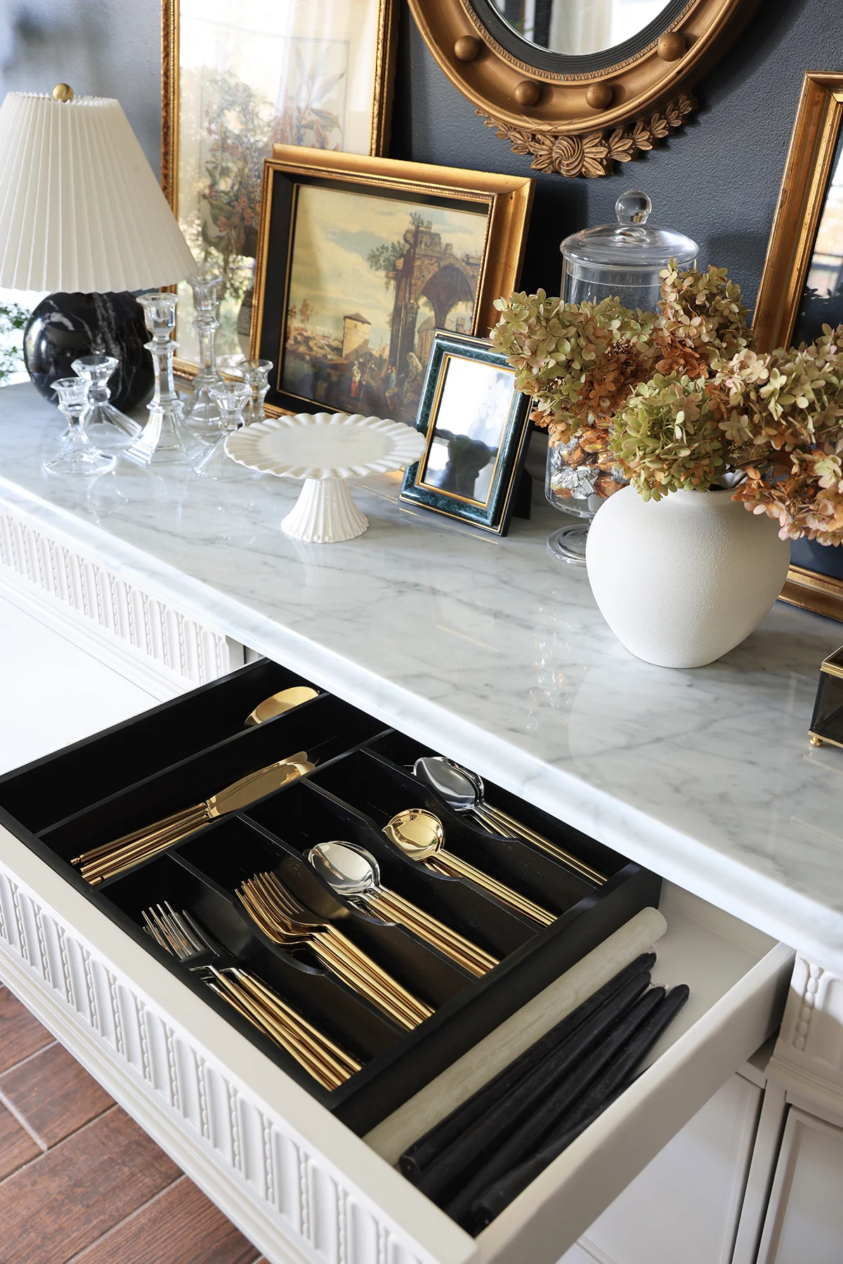 drawer with gold and silver utensils