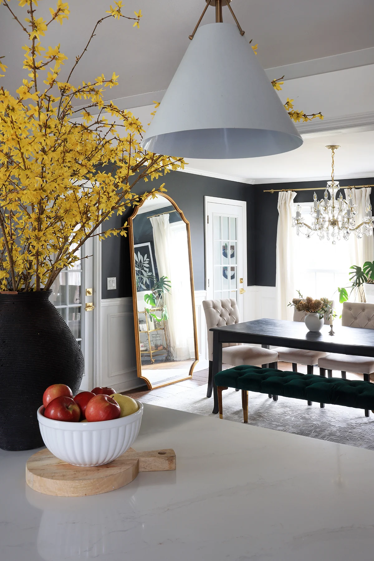 dining space with oversized wall mirror