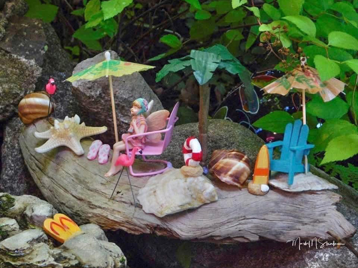 mini fairy figurines in a garden