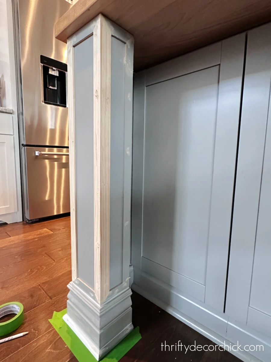 how to add custom diy details to a builder basic kitchen island | thrifty decor chick 5 framing out island legs with trim