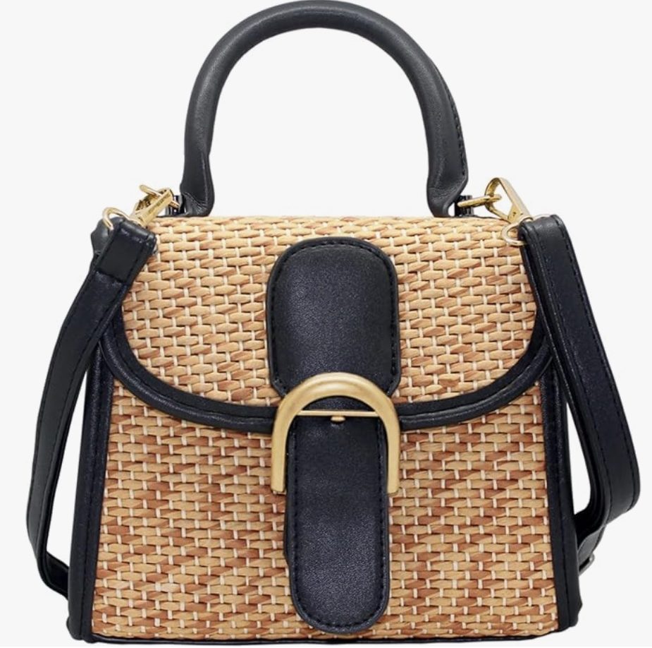 11 things i wish i bought sooner (april edition) 7 a structured handbag with a woven straw body, black leather trim, top handle, shoulder strap, and a prominent gold buckle on the front flap.