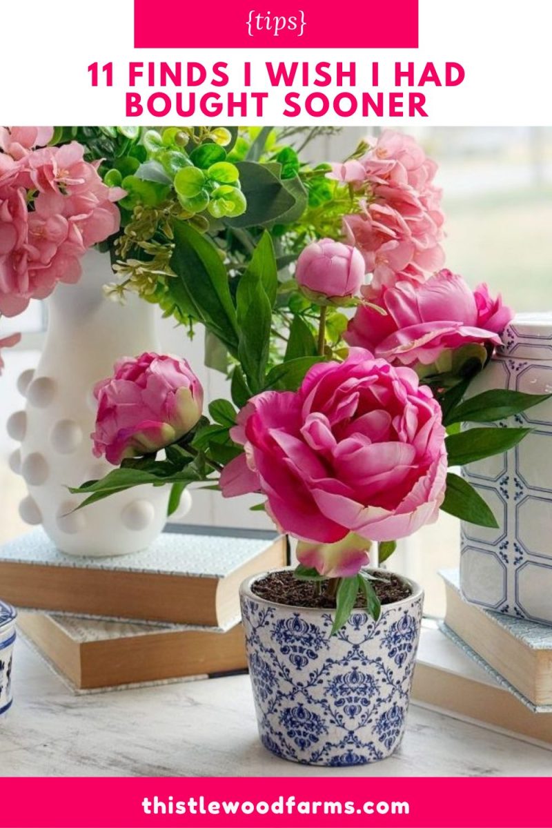 11 things i wish i bought sooner (april edition) 14 a blue and white patterned flowerpot holds vibrant pink peonies, surrounded by more pink flowers, books, and decor on a windowsill. text above reads "11 finds i wish i had bought sooner.
