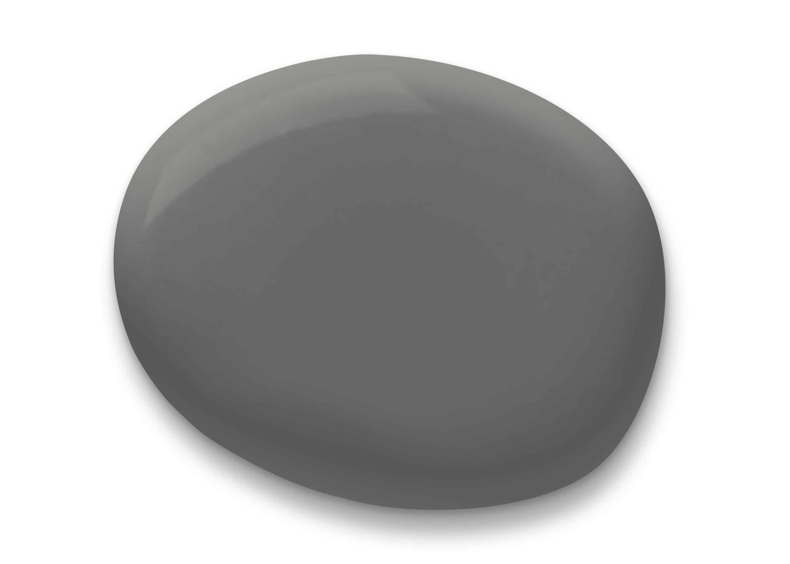 a smooth, dark grey, oval-shaped stone casting a soft shadow on a white background, giving a calm and simplistic visual.