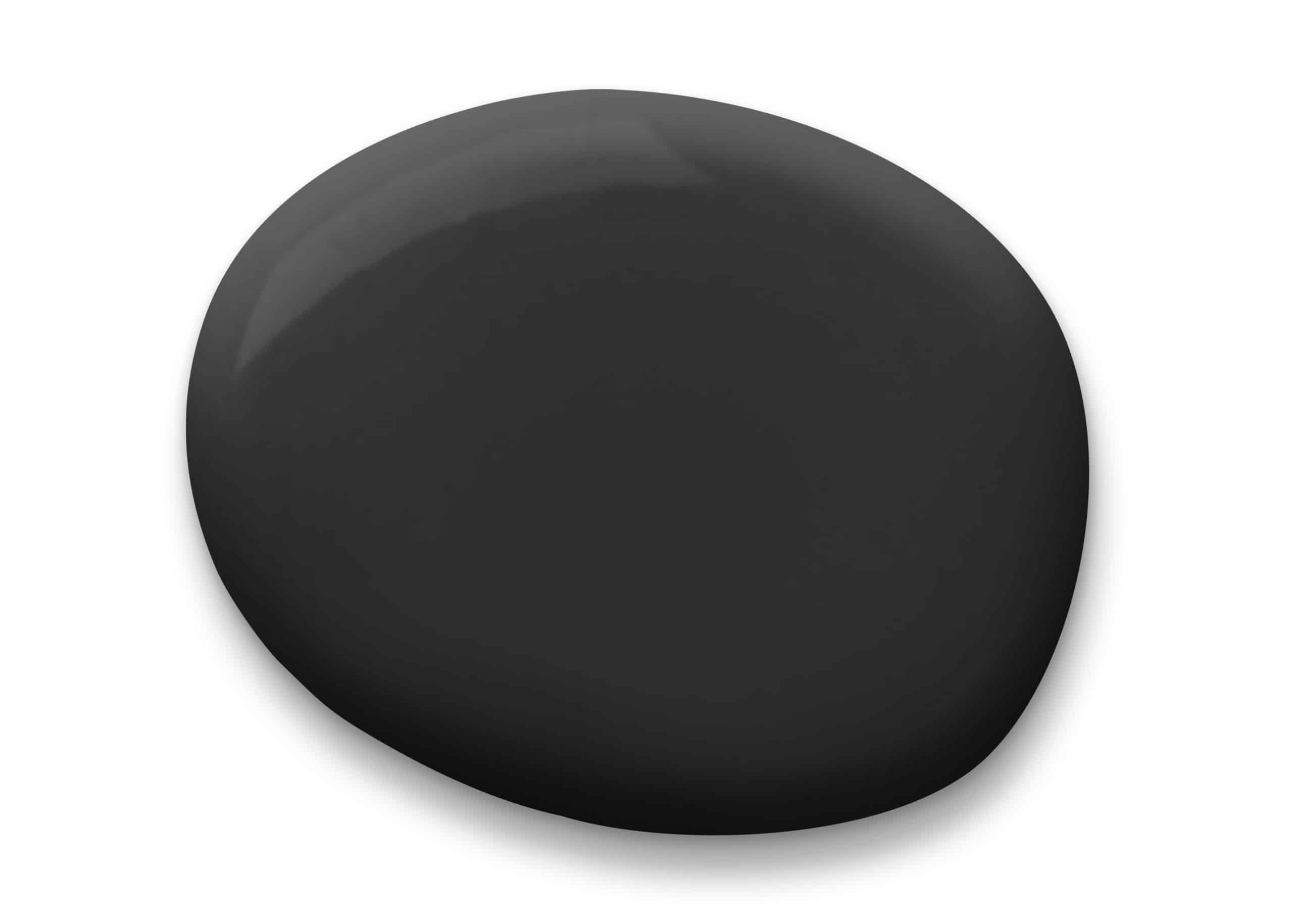 a simple, smooth, round, black stone positioned centrally against a plain white background.
