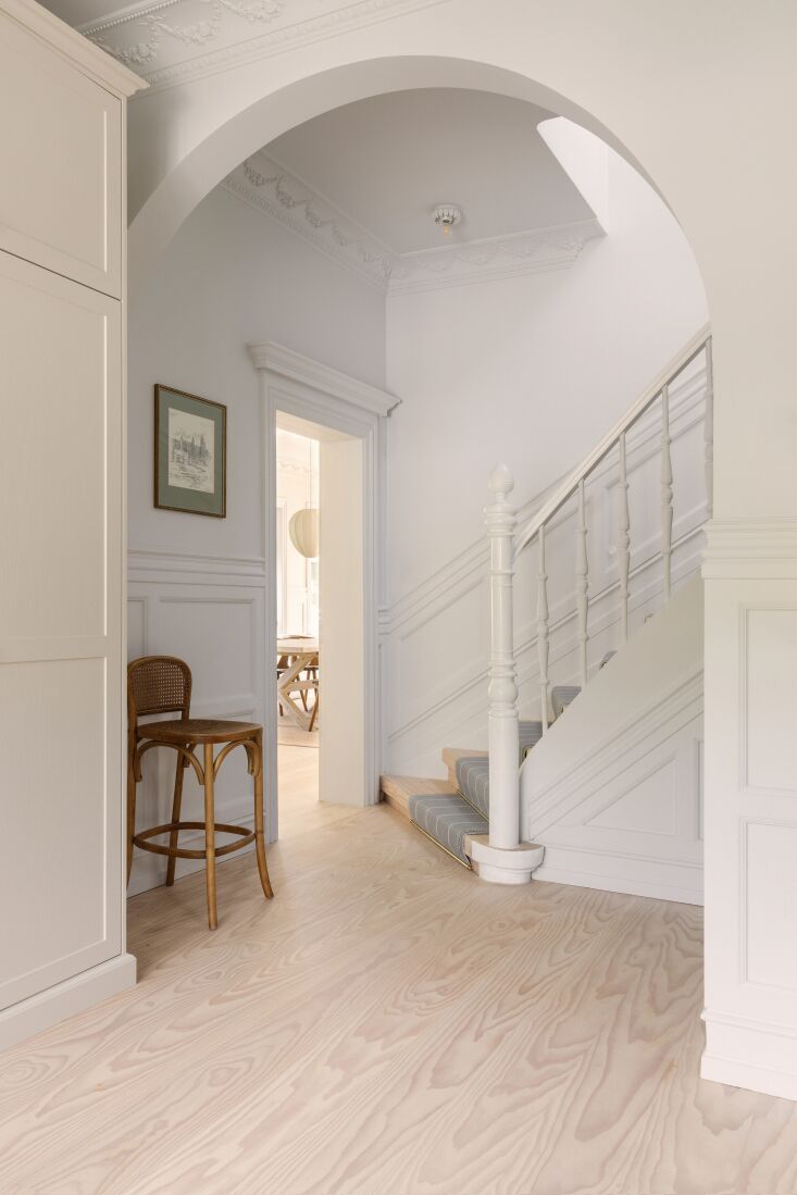 in contrast to the rich cream colored walls, the central stairwell is painted s 22
