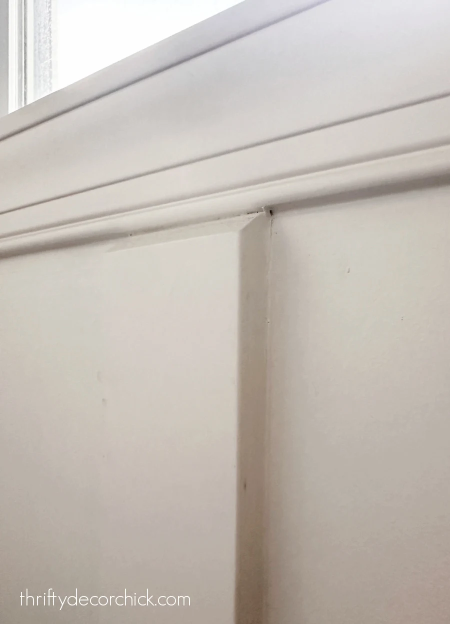 a pretty window diy and finishing touches in the powder room | thrifty decor chick 2 angled cut against window trim