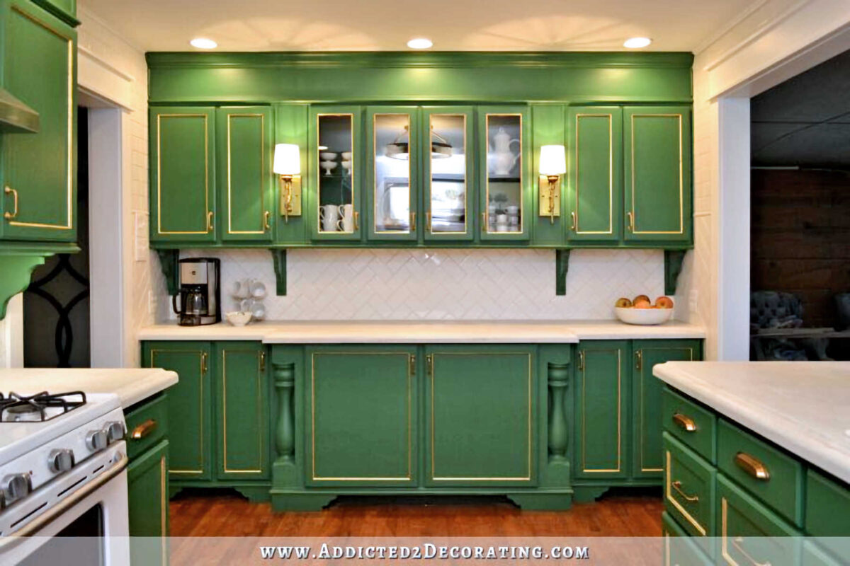 kitchen with green painted cabinets