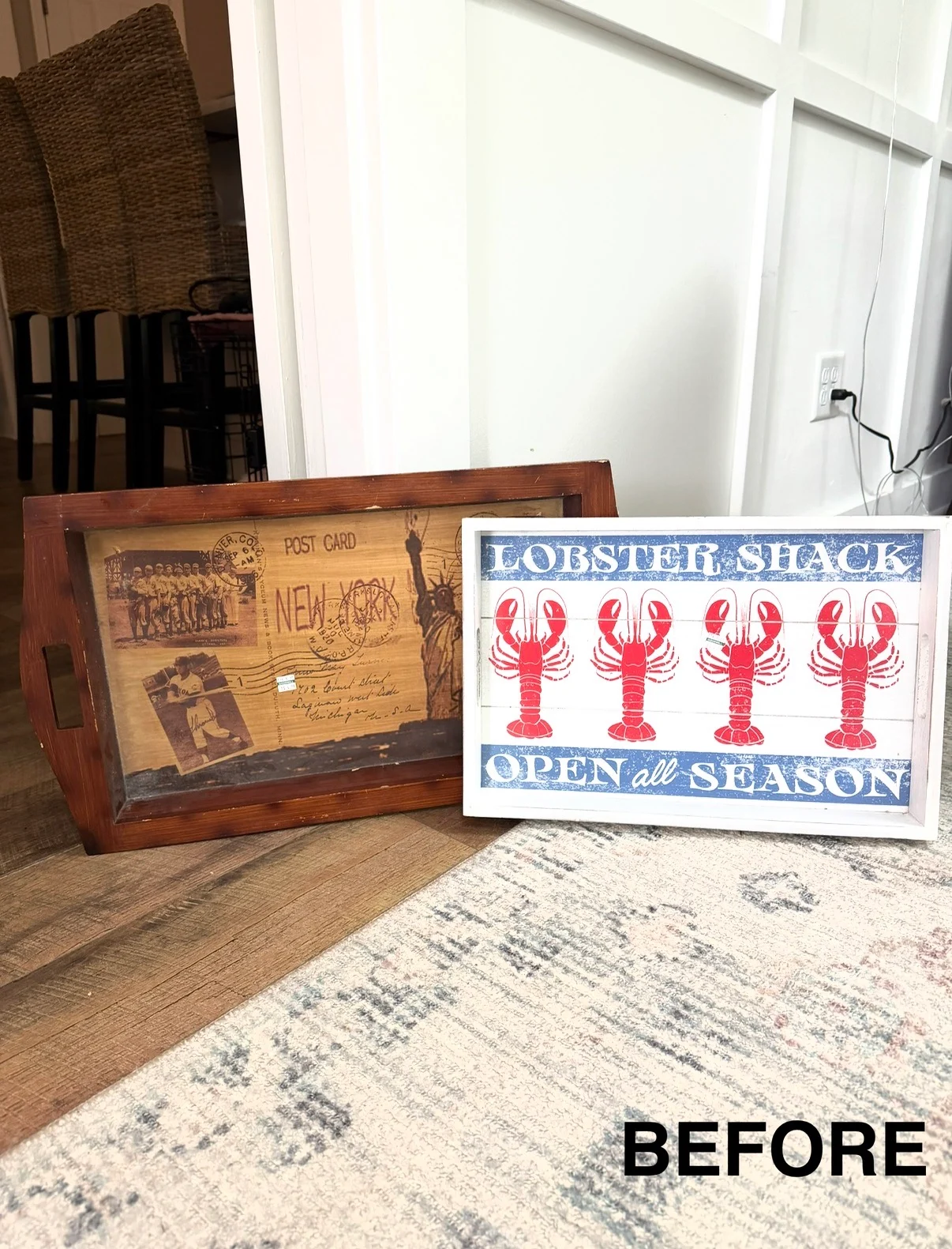 a wooden tray from a thrift shop, featuring a vintage new york postcard design and a framed “lobster shack open all season” sign with red lobsters, rests by a white wall. the word before appears in the bottom right corner.