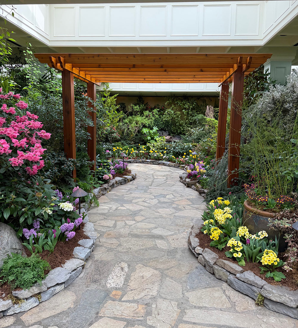 pergola over stone garden path