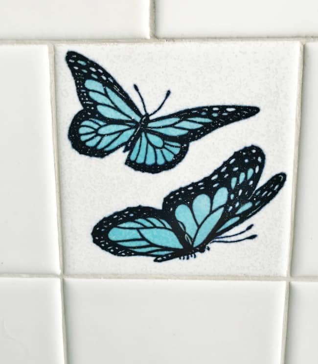so much tile, including these butterflies in the 1950s bathroom.