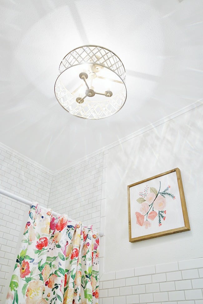 i fell in love with this light fixture and knew it would be perfect in the updated bathroom.