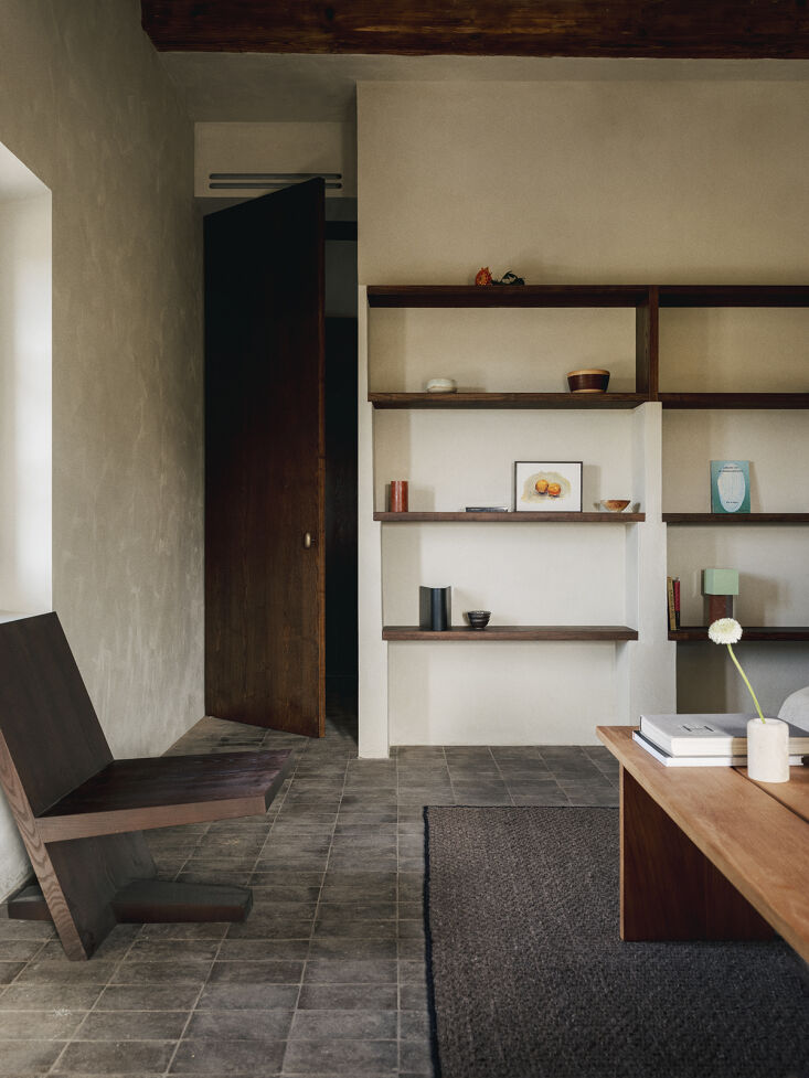 the architects worked with fred fabric to design custom shelving throughout the 19
