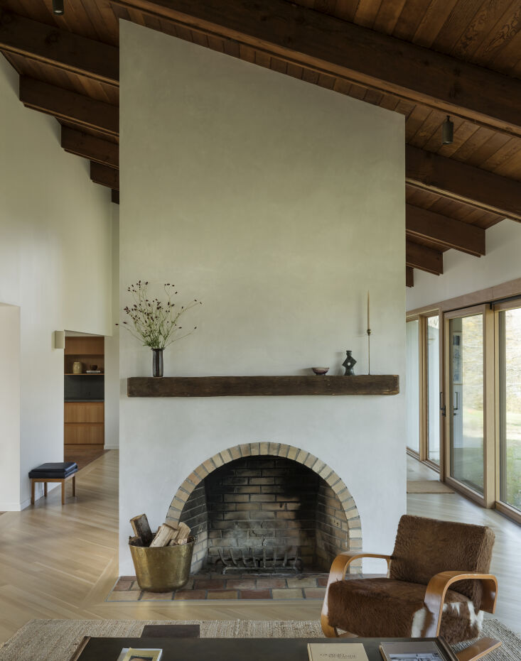 the original arched chimney breast is newly plastered and open to the surroundi 20